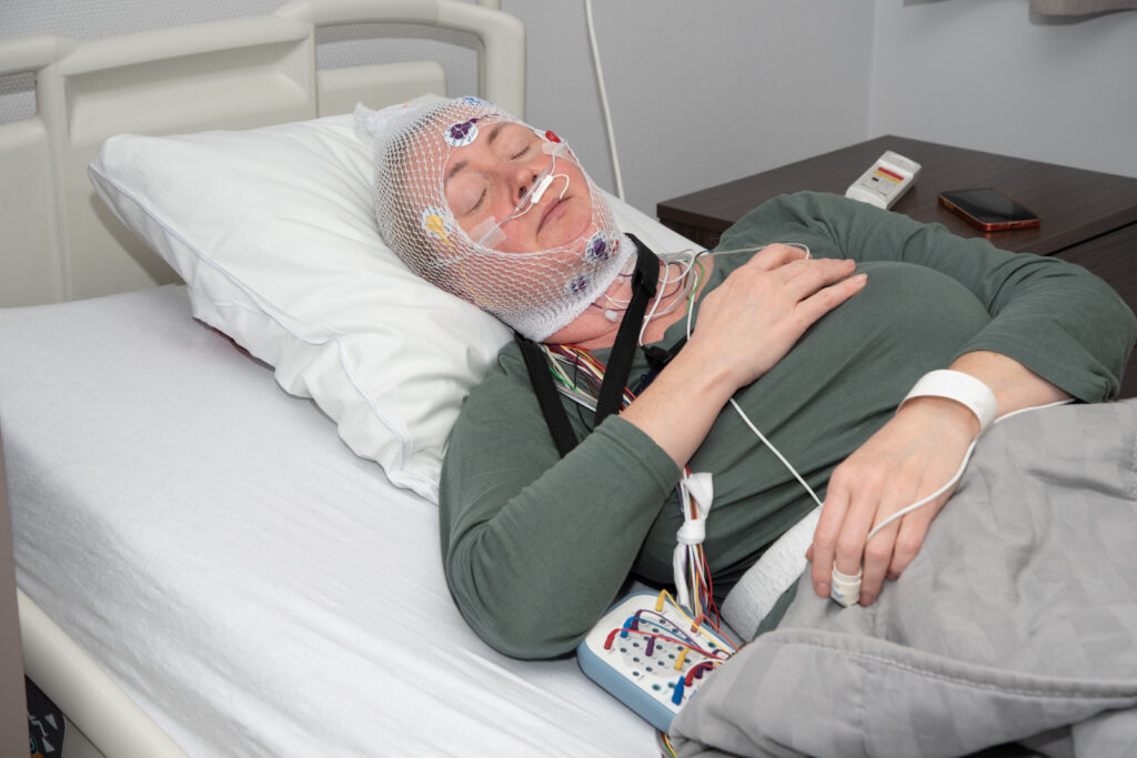 woman-lying-in-hospital-bed-with-medical-equipment